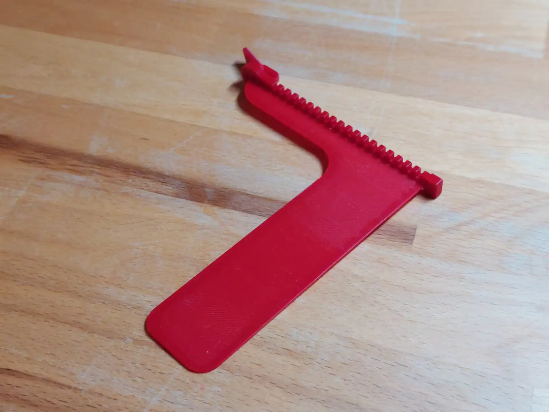 Boekenlegger Rits – speels design – kunststof – grijs, zwart, wit, roze, blauw & rood