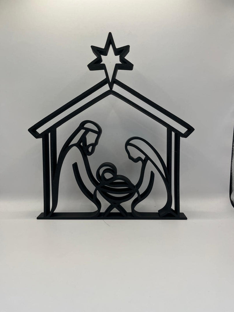 Moderne kerststal in silhouetstijl met ster, Jozef, Maria en kindje Jezus