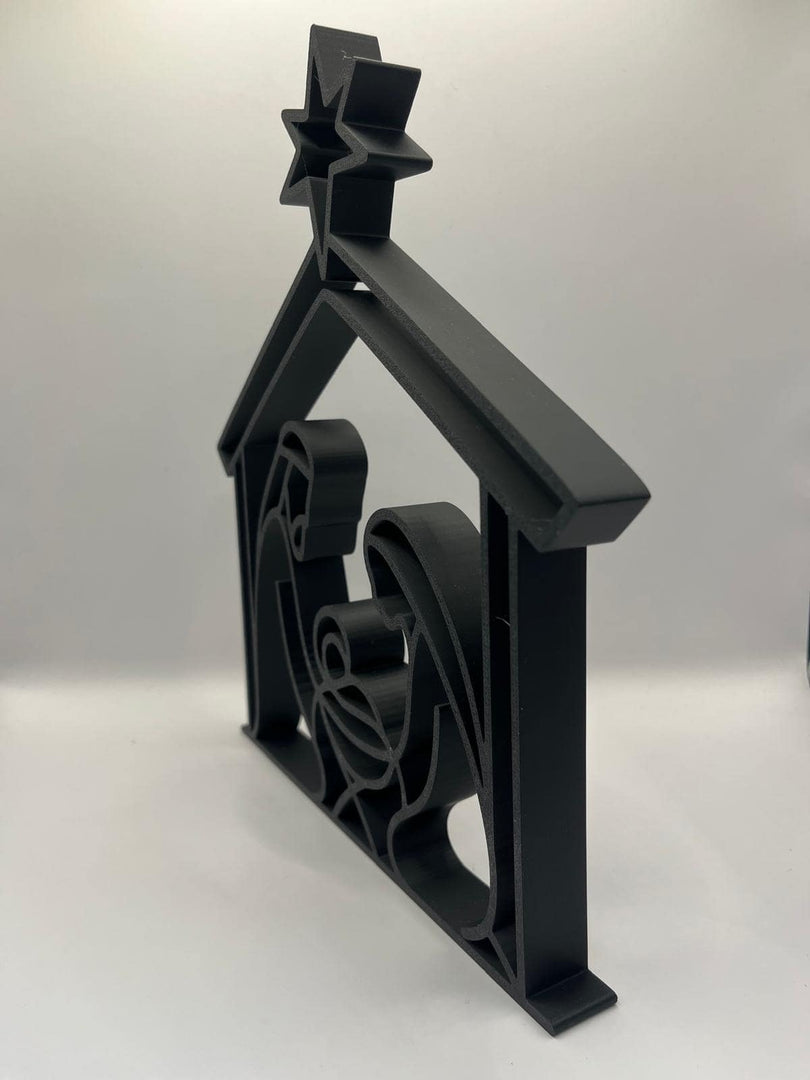 Zijaanzicht van moderne kerstdecoratie met heilige familie en ster