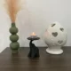 Decoratief olifantenbeeld op een stevige standaard, geschikt voor waxinelichtje of plantje, van HunoBa Creative.