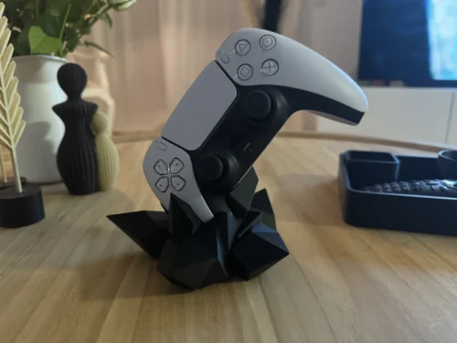 Verpakking van controlehouder set van twee stuks, met product zichtbaar op de achtergrond.